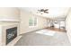A living room flows into an eat-in kitchen and features a fireplace at 8424 Nuckols Ln, Indianapolis, IN 46237