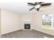 A living room features a fireplace, ceiling fan, and neutral tones at 8424 Nuckols Ln, Indianapolis, IN 46237
