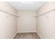 A walk-in closet with wire racks, carpeting, and neutral paint color, offering ample storage space at 8424 Nuckols Ln, Indianapolis, IN 46237