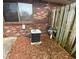 View of the HVAC system of the home near a window and a wooden fence at 914 Greenwood E Trl, Greenwood, IN 46142