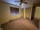 Bright bedroom featuring a large window and closet, offering a comfortable and inviting space at 914 Greenwood E Trl, Greenwood, IN 46142