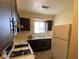 Functional kitchen with essential appliances and ample cabinet space, perfect for preparing delightful meals at 914 Greenwood E Trl, Greenwood, IN 46142