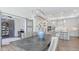 Dining room with a large table, a stylish chandelier, and view into the kitchen, creating an open, welcoming space at 9150 Bryce Cir, Zionsville, IN 46077