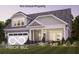 Charming home featuring a two-car garage, manicured lawn and craftsman-style architectural details at 9150 Bryce Cir, Zionsville, IN 46077
