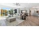 Comfortable living room with large sliding glass doors and an open layout connected to the dining area and kitchen at 9150 Bryce Cir, Zionsville, IN 46077