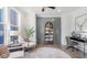 Comfortable living room showcasing stylish decor, light filled windows, and luxury vinyl plank flooring at 9150 Bryce Cir, Zionsville, IN 46077