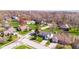 Aerial view of a mature subdivision with tree-lined streets and nicely landscaped lawns at 923 Jonathan Dr, Plainfield, IN 46168