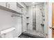 Modern bathroom featuring a glass-enclosed shower with decorative tile and updated fixtures at 923 Jonathan Dr, Plainfield, IN 46168