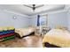 Bedroom with two twin beds, bookshelves and a ceiling fan at 923 Jonathan Dr, Plainfield, IN 46168
