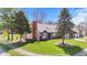 Traditional home featuring a well-kept lawn and mature trees at 923 Jonathan Dr, Plainfield, IN 46168