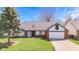 Charming single-Gathering home features a well-maintained lawn and attached garage at 923 Jonathan Dr, Plainfield, IN 46168