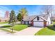 Charming single-Gathering home with attached garage, complemented by a lush, green lawn at 923 Jonathan Dr, Plainfield, IN 46168