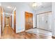 Hallway with hardwood floors, wooden doors, and a white front door with sidelights at 923 Jonathan Dr, Plainfield, IN 46168