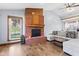 Bright living room with a brick fireplace and large window at 923 Jonathan Dr, Plainfield, IN 46168