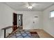 Simple bedroom includes rugs, two doors, one window, and a ceiling fan overhead at 947 E Bradbury Ave, Indianapolis, IN 46203