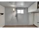 Unadorned room with carpet, a window with a lamp, and wood paneling at 947 E Bradbury Ave, Indianapolis, IN 46203
