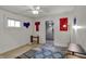 Decorated bedroom featuring a patterned rug and artwork adorning the walls, ceiling fan included at 947 E Bradbury Ave, Indianapolis, IN 46203