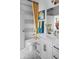 Bright bathroom featuring white vanity, unique floor tiles, and a colorful shower curtain at 998 Kinzer Ave, Carmel, IN 46032