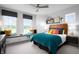 Cozy bedroom featuring a window seat with storage, designer touches and a full bed with teal coverlet at 998 Kinzer Ave, Carmel, IN 46032