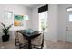 Bright dining area with modern table and chairs, and plenty of natural light at 998 Kinzer Ave, Carmel, IN 46032