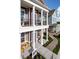 Inviting multi-Gathering homes with covered porch, white columns, and paved walkways at 998 Kinzer Ave, Carmel, IN 46032