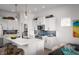 Bright, open kitchen with white cabinets, stainless steel appliances, and quartz countertops at 998 Kinzer Ave, Carmel, IN 46032
