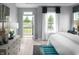 Bright main bedroom with ensuite access and ample natural light, creating a welcoming and relaxing atmosphere at 998 Kinzer Ave, Carmel, IN 46032
