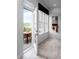 Sunlit mudroom featuring an open door with a view of a backyard patio at 998 Kinzer Ave, Carmel, IN 46032