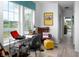 Bright office space with desk and leather chair, complemented by a view overlooking the neighborhood pond at 998 Kinzer Ave, Carmel, IN 46032