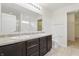 Bathroom features a dual sink vanity and large mirror at 10016 Jenna Ln, Indianapolis, IN 46239