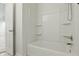 Clean bathroom with a white shower/tub combo and white walls at 10016 Jenna Ln, Indianapolis, IN 46239