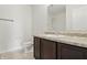 Bathroom featuring vanity with dark wood cabinets and a toilet at 10016 Jenna Ln, Indianapolis, IN 46239