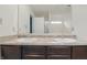 Bathroom featuring a dual sink vanity and large mirror at 10016 Jenna Ln, Indianapolis, IN 46239