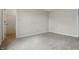 Carpeted bedroom featuring a walk-in closet with shelving and neutral walls and trim at 10016 Jenna Ln, Indianapolis, IN 46239