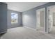 Empty bedroom featuring neutral walls, carpet and a window view at 10016 Jenna Ln, Indianapolis, IN 46239