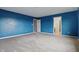 Carpeted bedroom painted in a blue color at 10016 Jenna Ln, Indianapolis, IN 46239