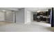Open-concept kitchen with black appliances, an island, and neutral wall colors at 10016 Jenna Ln, Indianapolis, IN 46239