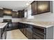 Stylish kitchen with sleek black appliances, dark cabinetry, and functional island at 10016 Jenna Ln, Indianapolis, IN 46239