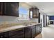 Well-lit kitchen features stainless steel appliances, ample counter space and views to the backyard at 10016 Jenna Ln, Indianapolis, IN 46239