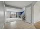 Inviting living room with fireplace and large window, complemented by neutral colors and tile entryway at 10016 Jenna Ln, Indianapolis, IN 46239