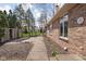 Home exterior featuring a brick facade and sidewalk to the backyard at 10109 Fergus Ave, Carmel, IN 46032