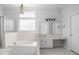 Bright bathroom with a large soaking tub, walk-in shower, and ample counter space and storage at 10109 Fergus Ave, Carmel, IN 46032