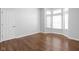 Spacious bedroom with hardwood floors and lots of natural light from the large bay window at 10109 Fergus Ave, Carmel, IN 46032