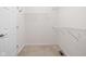 Walk-in closet with neutral carpet and wire shelving for organized storage solutions at 10109 Fergus Ave, Carmel, IN 46032