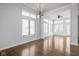 Bright dining room with hardwood floors, large windows, and open access to other living spaces at 10109 Fergus Ave, Carmel, IN 46032