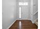 Inviting foyer with hardwood floors, a chandelier, and a view of the staircase and front door at 10109 Fergus Ave, Carmel, IN 46032