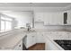 Spacious kitchen with white cabinets, stainless steel appliances, and an open layout at 10109 Fergus Ave, Carmel, IN 46032