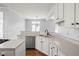 Well-designed kitchen featuring white cabinets, stainless steel appliances, and a functional layout at 10109 Fergus Ave, Carmel, IN 46032