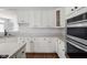 Modern kitchen with white cabinets, stainless steel appliances, and ample countertop space at 10109 Fergus Ave, Carmel, IN 46032