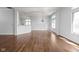 Open-concept living room with beautiful hardwood floors and large windows for ample natural light at 10109 Fergus Ave, Carmel, IN 46032
